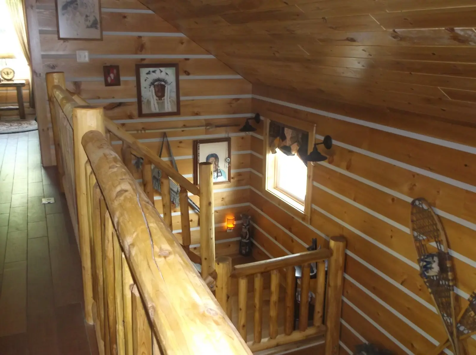 Adirondack siding with chink paint on interior walls under a tongue and groove ceiling
